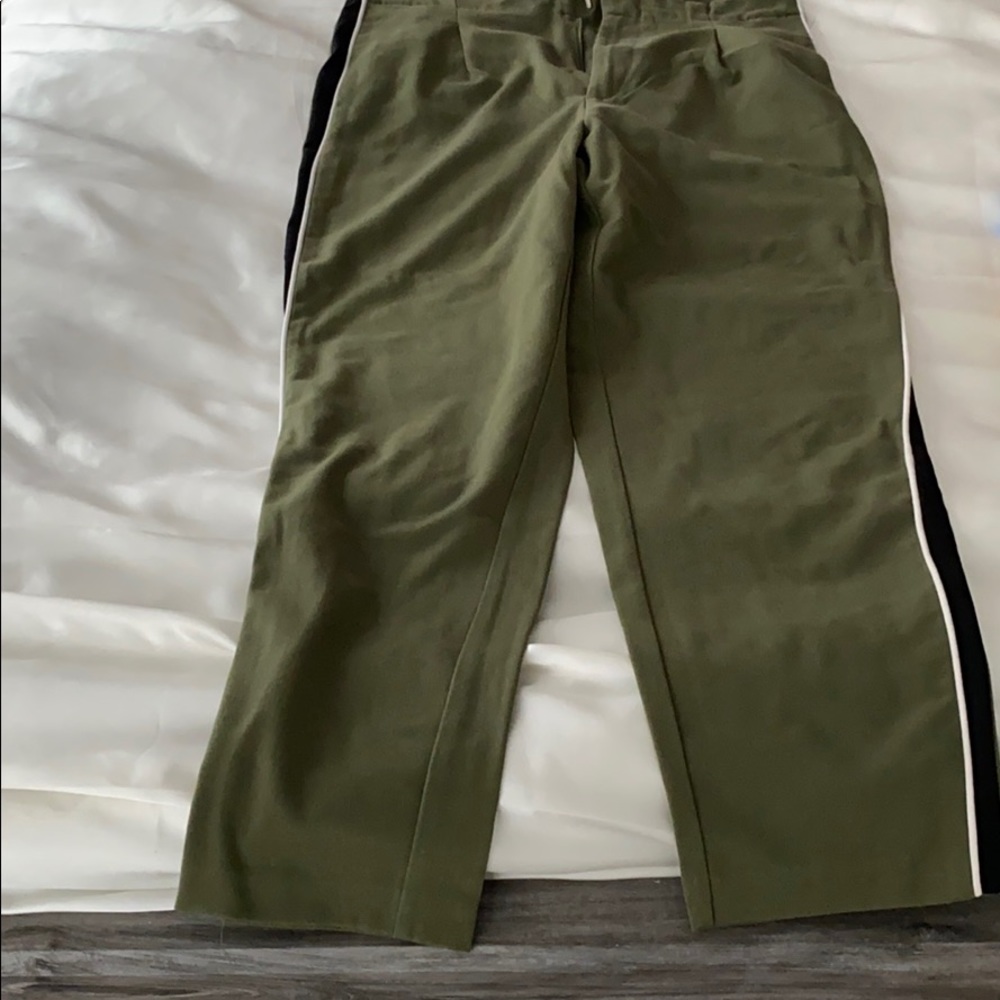 Green pants with black and white stripes